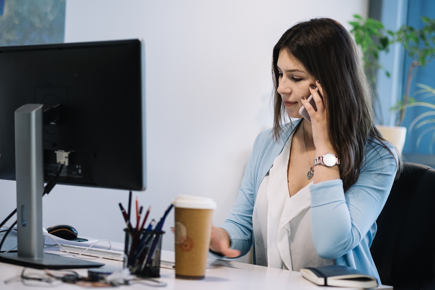 woman-talking-phone-office